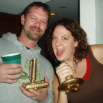 Nate Johnson and Alyssa showing off their golden joystick trophies they got for winning the Wii Tennis tournament